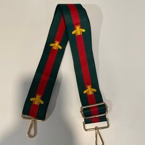 red & green bag strap w yellow bee print